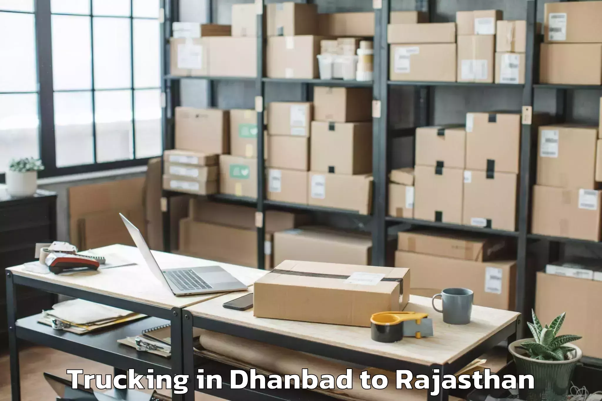 Book Dhanbad to University Of Rajasthan Jaipur Trucking Online